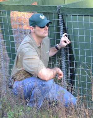Jon Croci, Compliance Supervisor, reviews the Walter Reed Army Institute of Research entomological project on barriers and the control potential diseases.